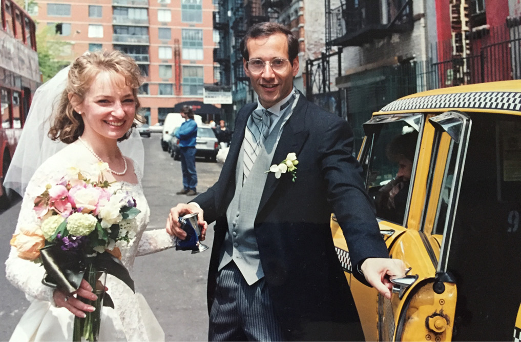 married couple getting into vintage yellow cab