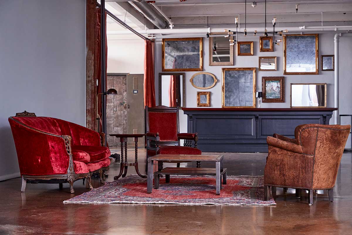 Wall of Vintage Mirrors and Seating Area
